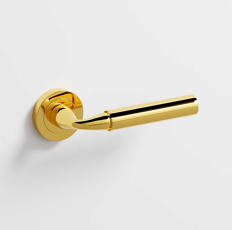 Neo · Manillas roseta para puerta en dorado brillo
